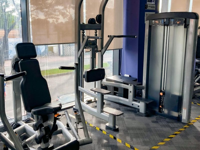 Minimalist home gym space with sunlight coming through window