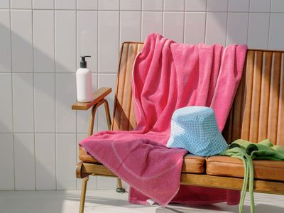 Water bottle and towel on a clean bench